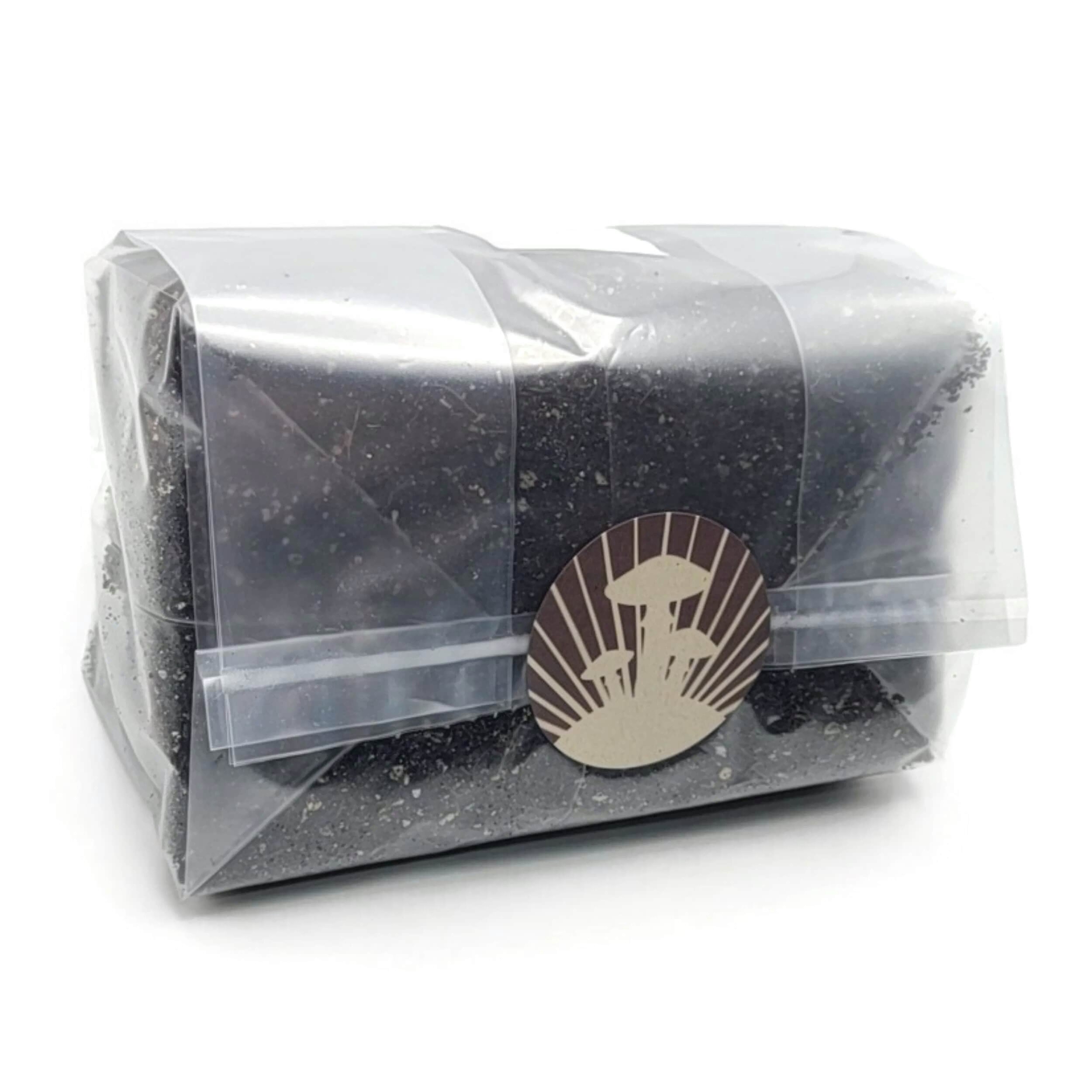 A sealed plastic bag filled with a rich brown coco coir substrate mix, enhanced with vermiculite and gypsum particles.